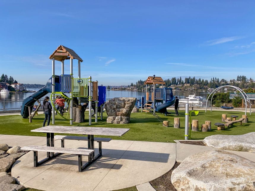 Meydenbauer Bay Park Playground in Bellevue, Washington, featuring modern play structures and climbing equipment with scenic waterfront views of Lake Washington. This top-rated playground is a favorite for families, offering both fun and relaxation along the Eastside shoreline.