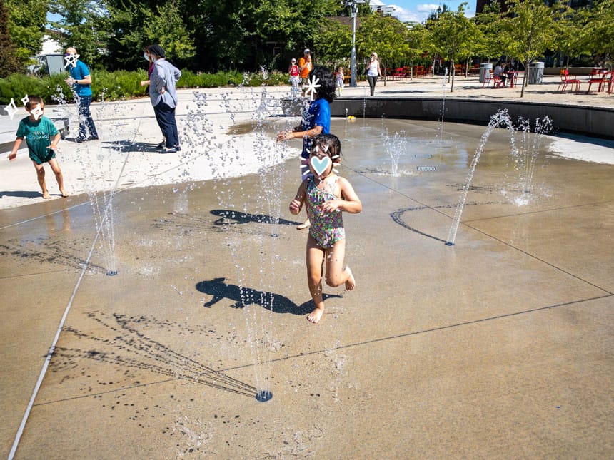 Redmond Downtown Park - Splay Pad Toddler Running Through the Water