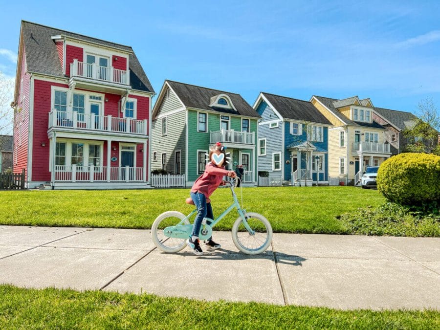 Toddler posing on her beach cruiser bike in the middle of Seabrook Washington