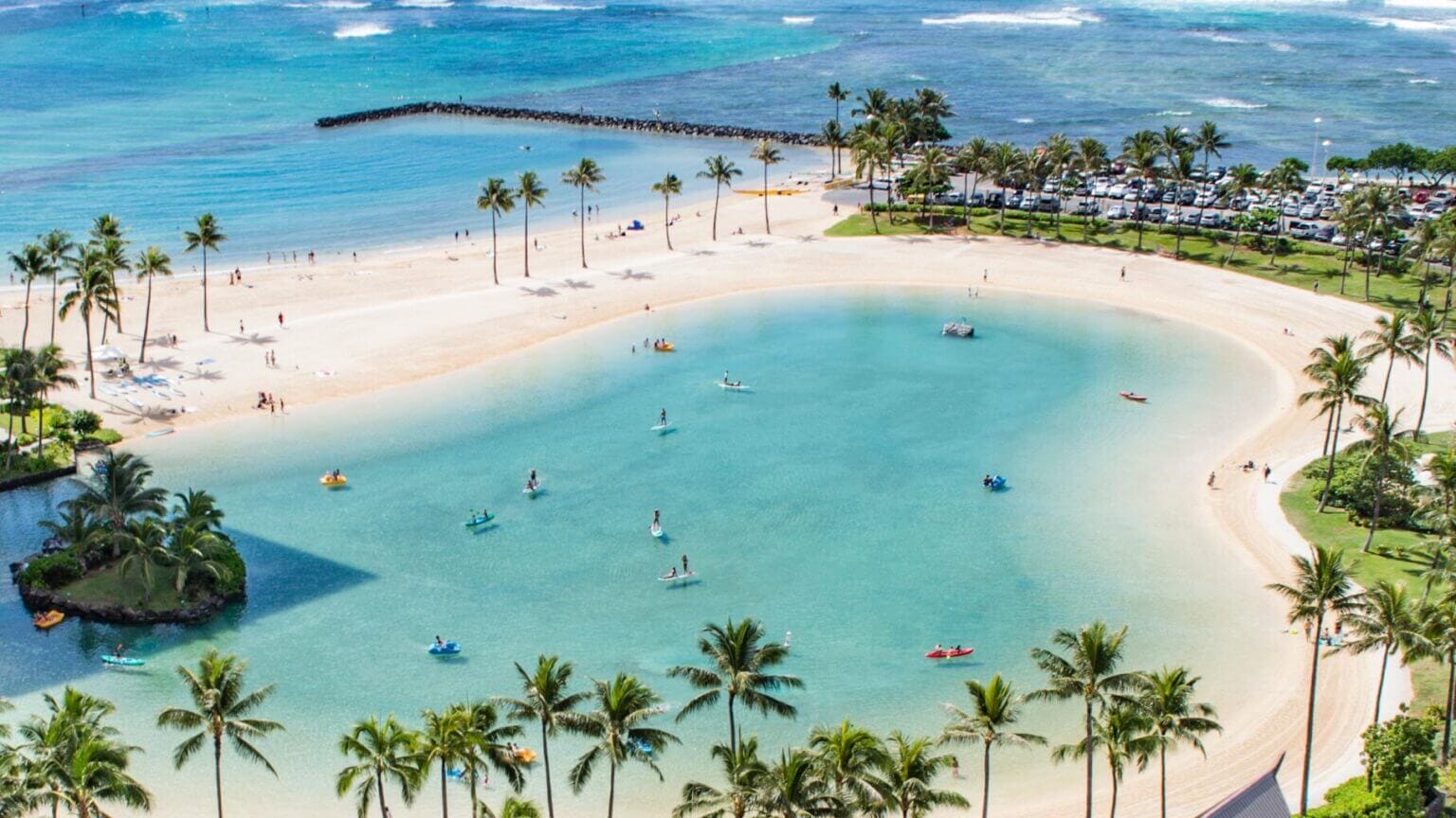Hilton Lagoon in Waikiki, another famous man made lagoon in Oahu for swimming, paddle-boarding, and water bike rentals