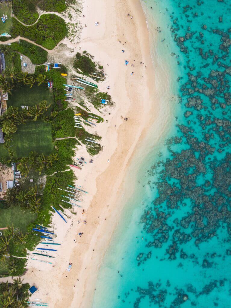 Aerial view of Lanikai Beach in Kailua Hawaii, known for the soft sand, and blue waters, this is one of the most popular Oahu beaches among tourist and locals.