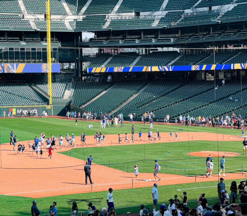 Mariners Baseball game Seattle, Kids Run Around The Bases, photo from the stands, more then 20 kids on the field running