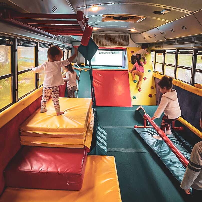Dizzy’s Tumblebus in Bellevue offers a unique and engaging summer camp experience where kids can enjoy gymnastics and active play inside a colorful, converted school bus. The interior of the Tumblebus is transformed into a mobile gym filled with padded floors, mini balance beams, climbing equipment, tunnels, and bars—designed perfectly for young children to explore movement and coordination in a fun and safe setting. Whether as part of a summer camp program or a mobile visit to local preschools and community centers, Dizzy’s Tumblebus brings high-energy gymnastics right to the kids, making fitness accessible, exciting, and perfect for toddlers and preschoolers in the Eastside area.