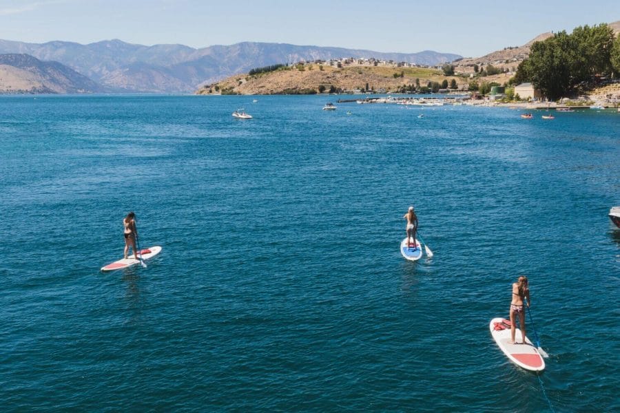 Summer at Lake chelan, perfect summer vacation with kids, boat or paddle board on the lake, relax on sandy beaches and more.