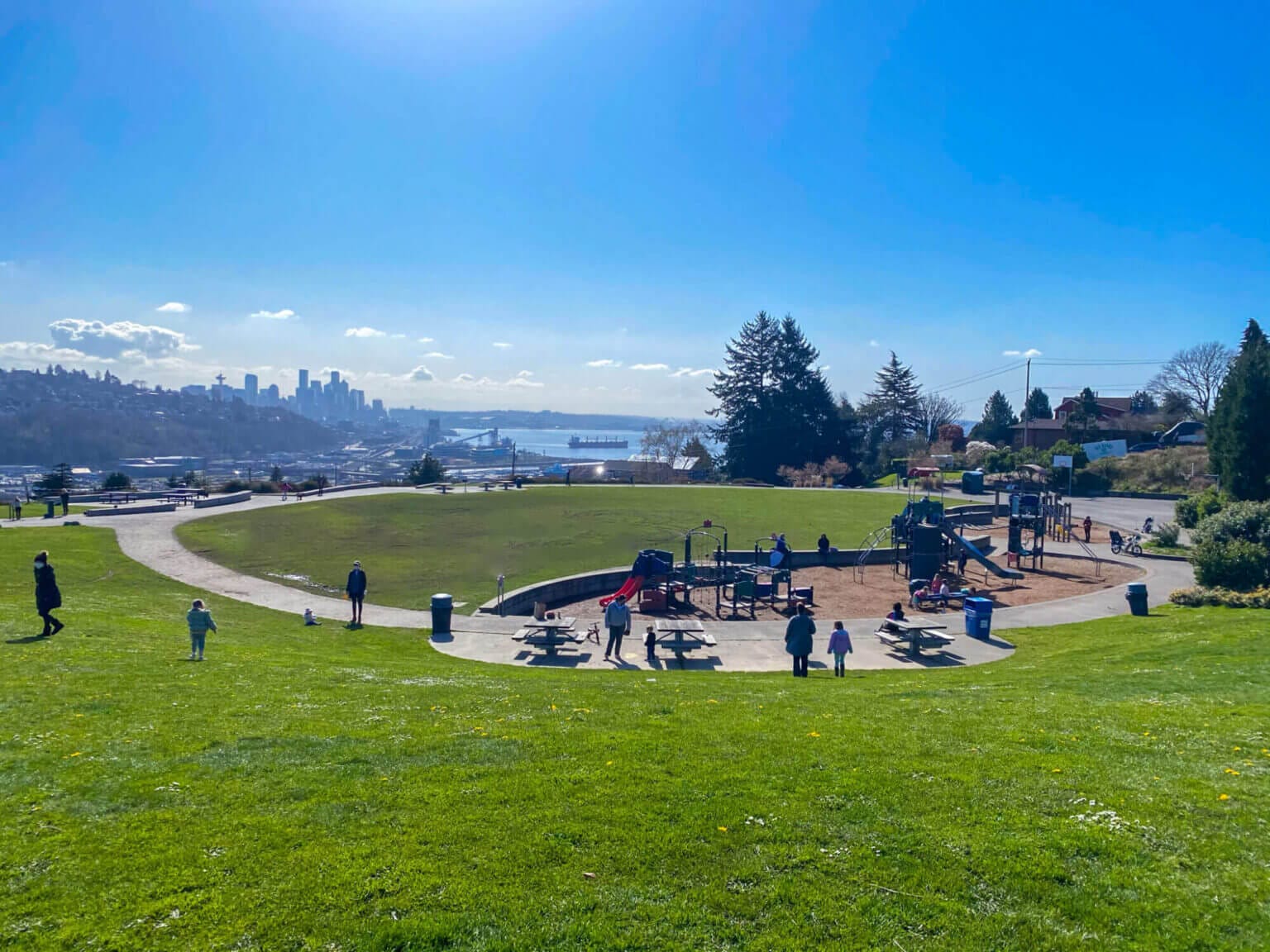 Ella Bailey Park in Seattle with a skyline view and a playground for kids.