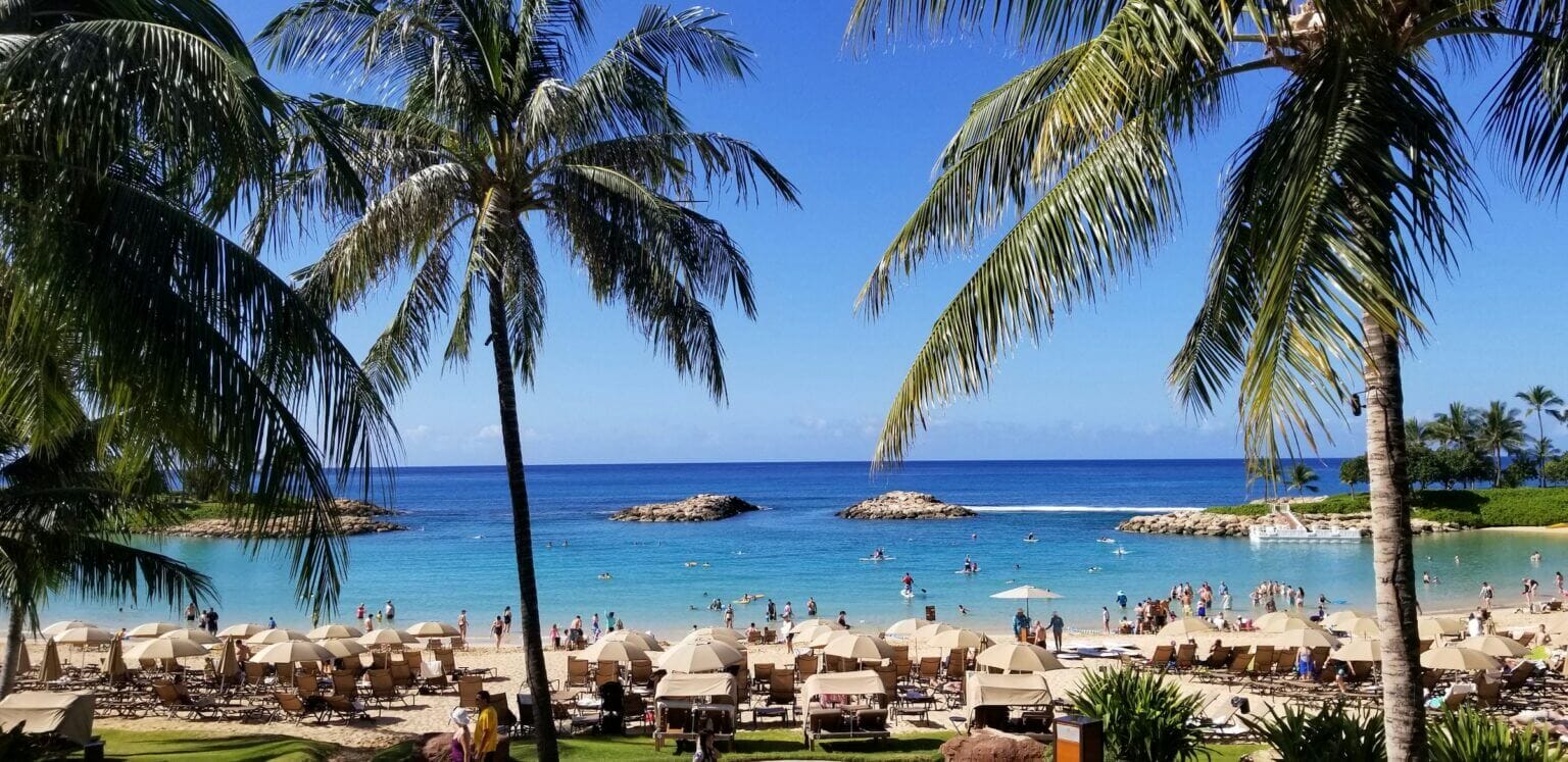 Ko’Olina Lagoons with luxury resorts like Disney Aulani and Four Seasons, family-friendly beach.