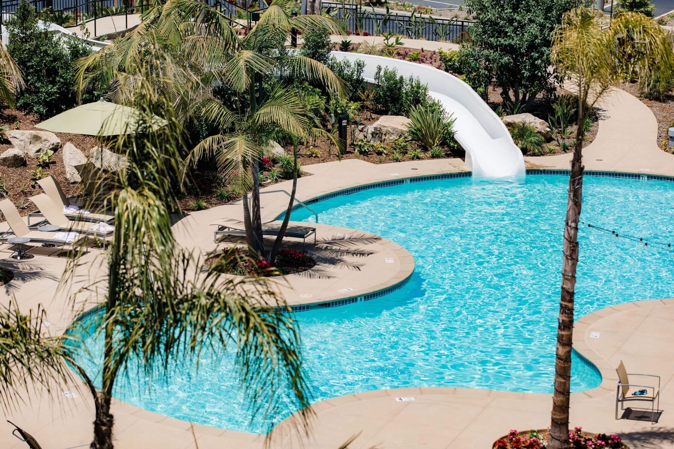 Sheraton Carlsbad Resort & Spa outdoor pool with a slide, perfect for families visiting the area.