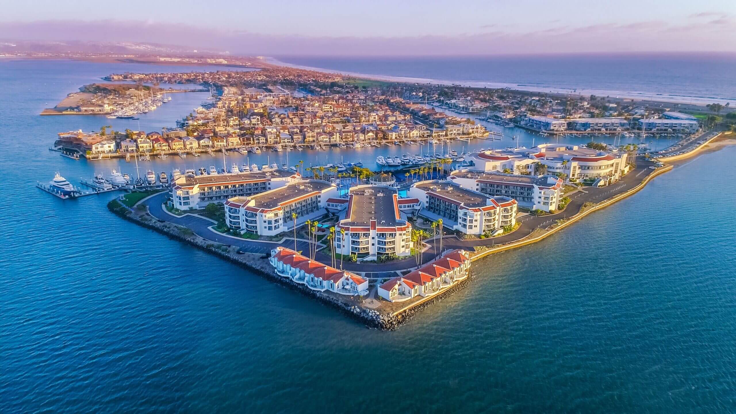 Aerial view of Loews Coronado Bay Resort, a highly-rated family-friendly hotel in San Diego featuring three outdoor pools for family fun.