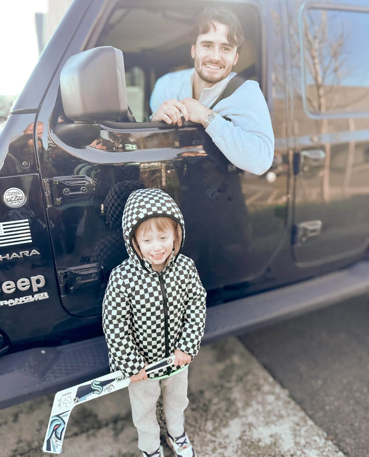 Seattle Kraken with kids guide: After practice at the Kraken Community Iceplex, young fans have the exciting opportunity to meet players, get autographs, and take photos. The players love interacting with little kids, making it a memorable experience for young hockey fans. Our 4-year-old had a blast meeting his favorite player, Joey Daccord, capturing special moments with photos and signed memorabilia.