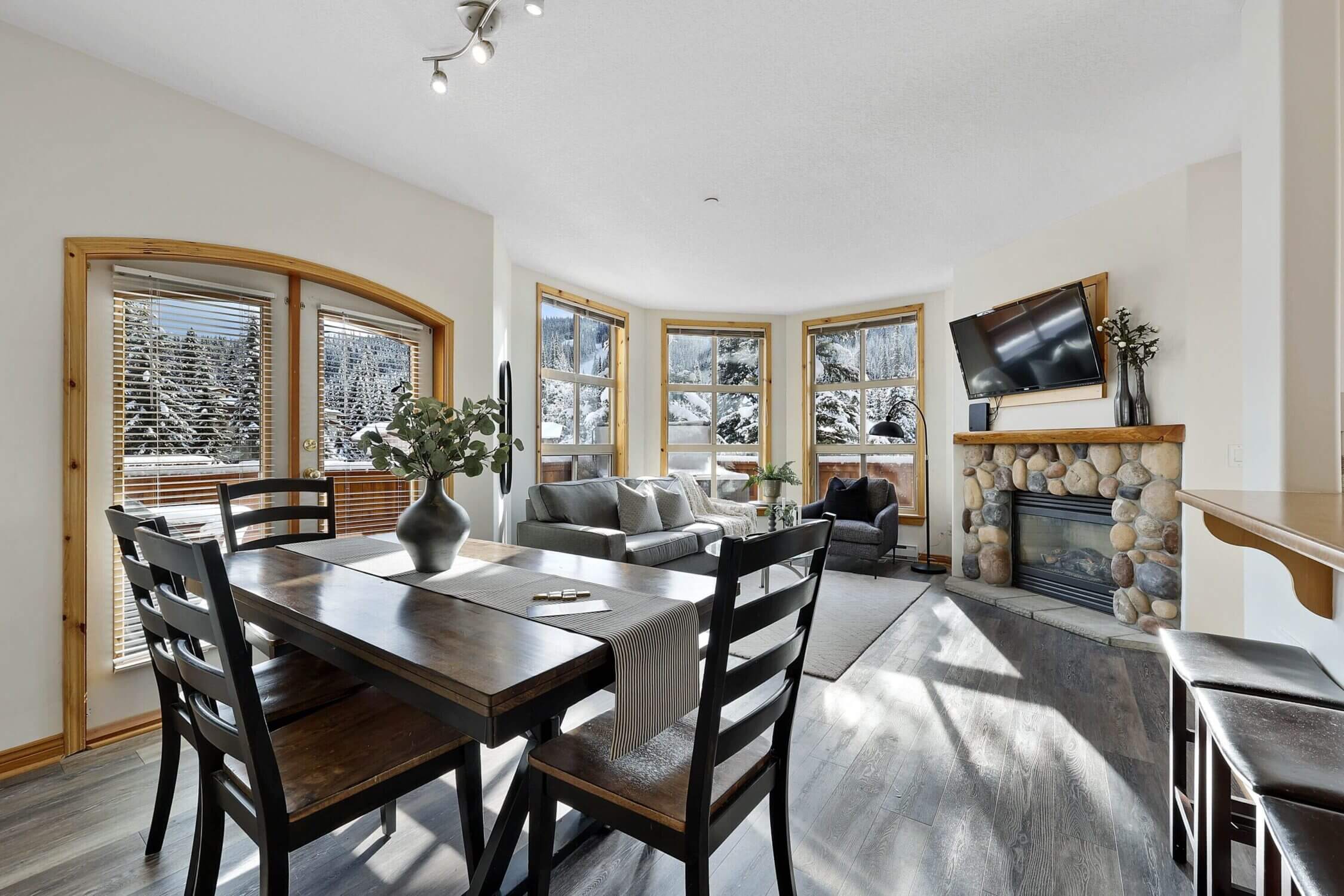Crystal Forest #50 in Sun Peaks features a spacious and inviting living room, perfect for relaxing with the whole family after a day on the slopes. With cozy seating, a fireplace, and mountain-inspired décor, the living area is ideal for movie nights, board games, or simply warming up with hot cocoa. Adjacent to the living room is a large dining table that comfortably seats the entire group—great for family meals, holiday dinners, or morning breakfasts before hitting the lifts. The open-concept layout encourages togetherness and makes this vacation rental a true home away from home for larger families or groups traveling together.