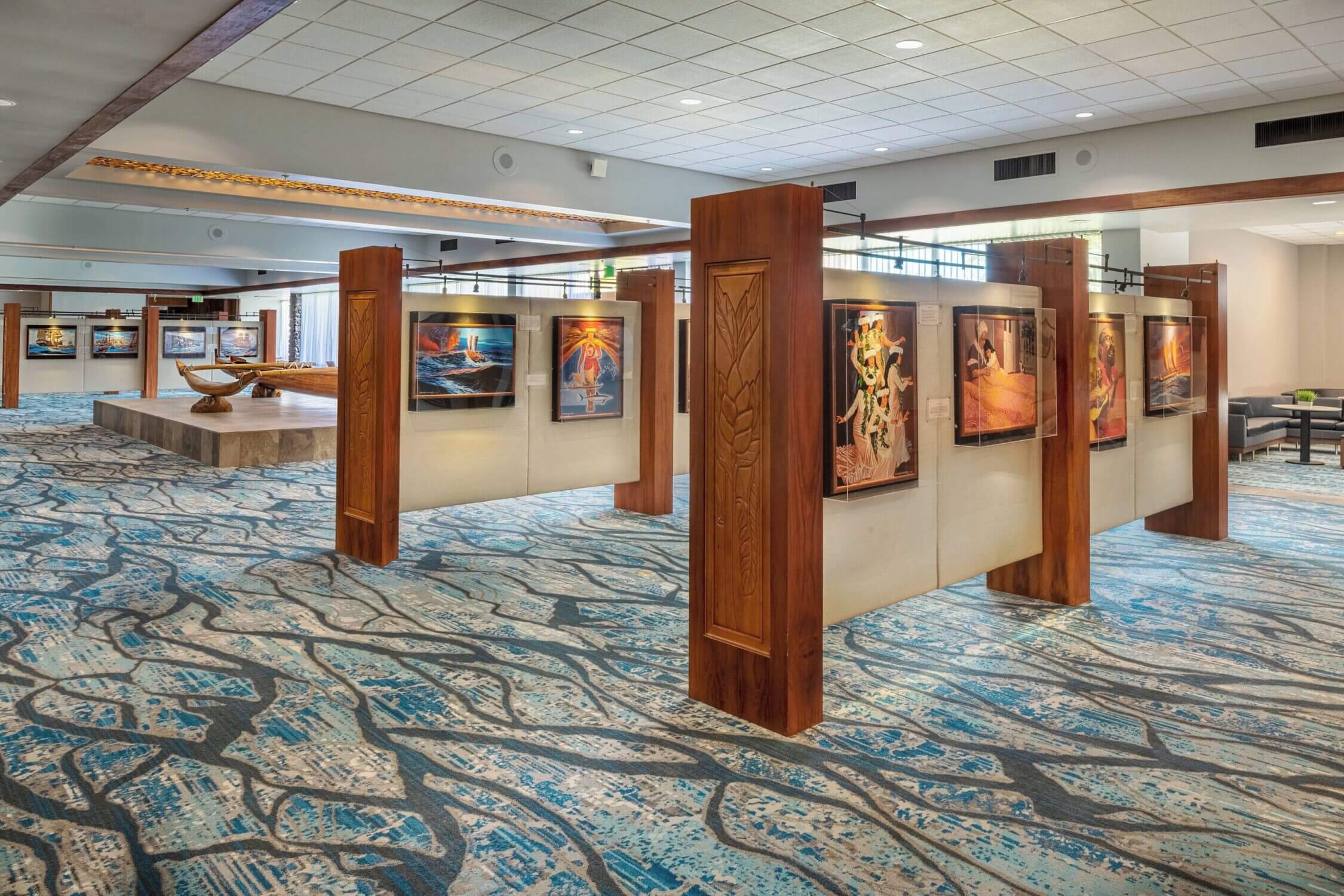 Inside the Courtyard by Marriott King Kamehameha’s Kona Beach Hotel on the Big Island, guests can explore traditional Hawaiian cultural displays, including a beautifully crafted canoe and hanging local artwork. These exhibits provide an educational and immersive experience for families, helping kids connect with the history and spirit of Hawaiʻi while staying at this centrally located Kailua-Kona resort.