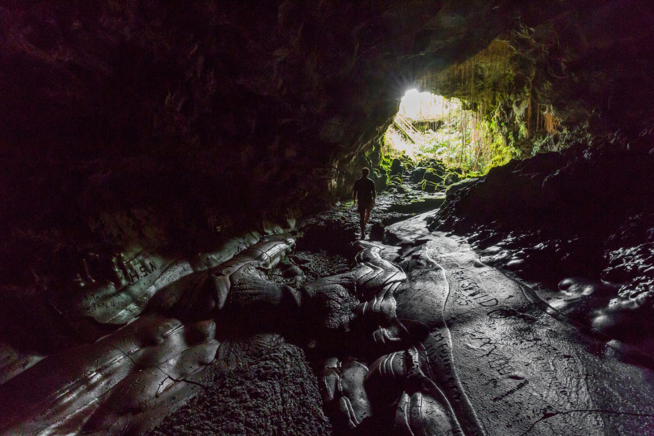 Walking through the lava tube at Hawai‘i Volcanoes National Park, one of the top family-friendly activities to do in Hilo on the Big Island. This incredible park lets visitors experience volcanic landscapes, steam vents, and ancient lava flows. Kids love exploring the massive lava tube, an easy and fun hike that feels like stepping into another world—making it a must-see in our guide to things to do with kids in Hilo.