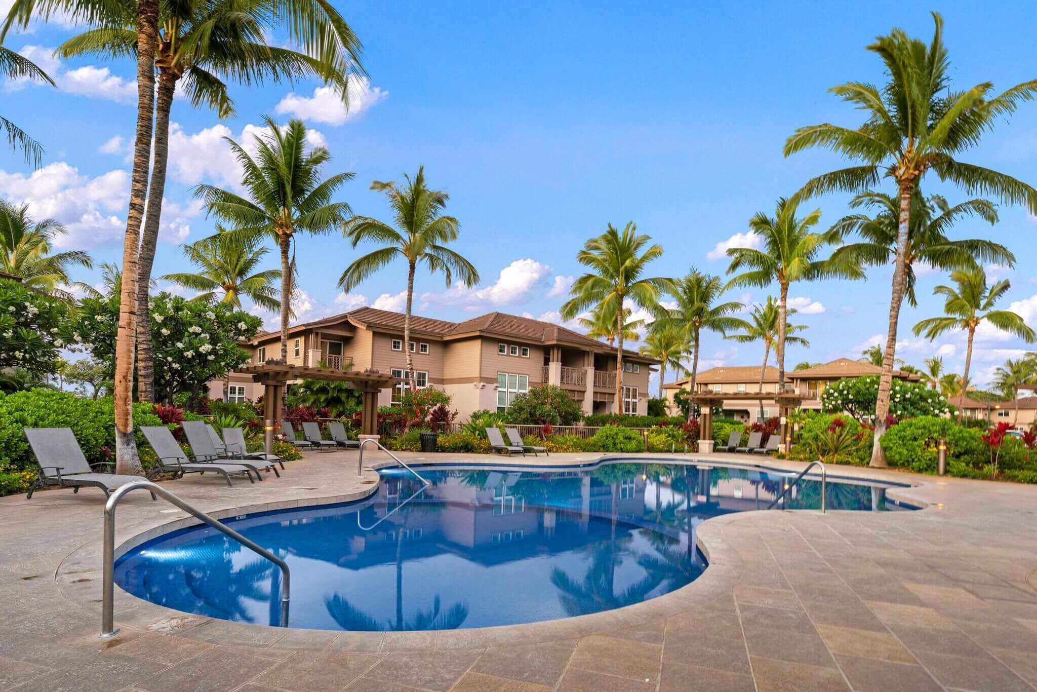 Waikoloa Colony Villas pool, a serene and spacious area for guests staying at this family-friendly vacation rental on the Kona side of the Big Island. Featured in our blog as a recommended place to stay with kids, this rental was perfect for a multigenerational trip, offering ample space, full kitchen, and access to great amenities like this pool—ideal for relaxing after a day of exploring the island.
