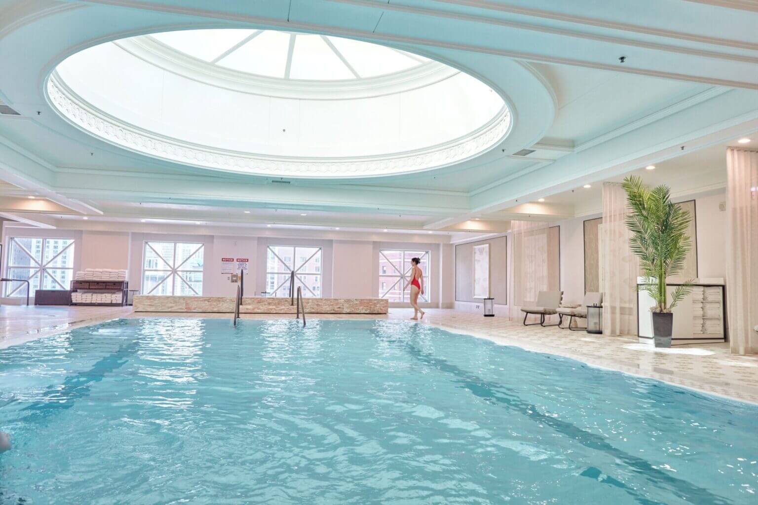 Four Seasons Chicago indoor pool with lounge chairs and elegant design, a kid-friendly amenity that makes it our top pick for families visiting Chicago.
