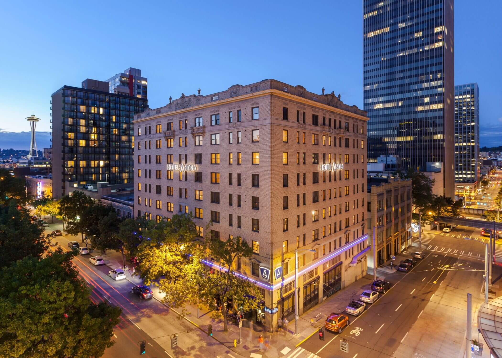 Aerial view of Hotel Ändra in Seattle’s Belltown neighborhood, with the iconic Space Needle in the background—featured in our blog on the best places to stay with kids in Seattle.