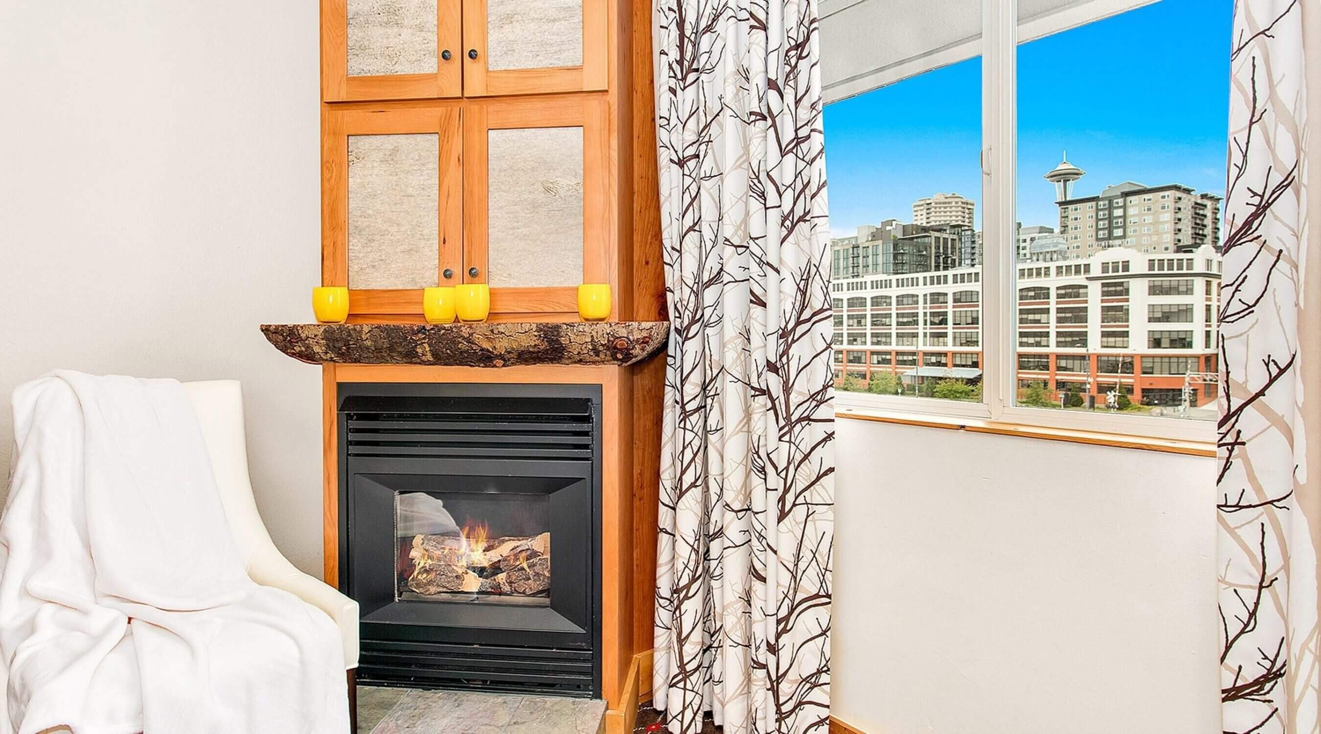 Edgewater Hotel city view room with cozy fireplace and a stunning view of the Seattle Space Needle, great family-friendly hotel in Seattle.