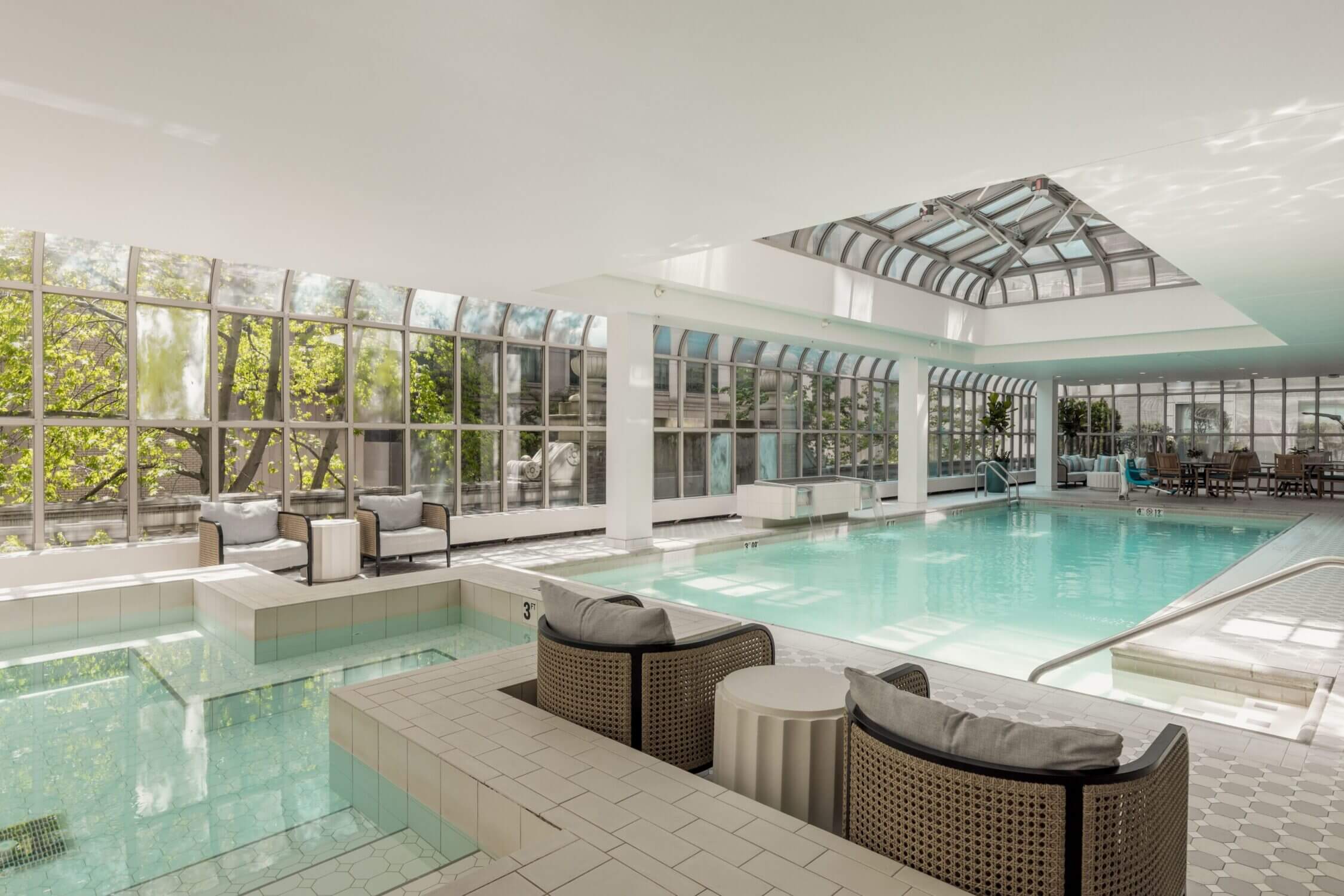 Elegant indoor pool at the historic and luxurious Fairmont Olympic Hotel in downtown Seattle, a favorite for families with kids. The serene atmosphere, classic design, and convenient location make it one of the best places to stay with kids in Seattle.