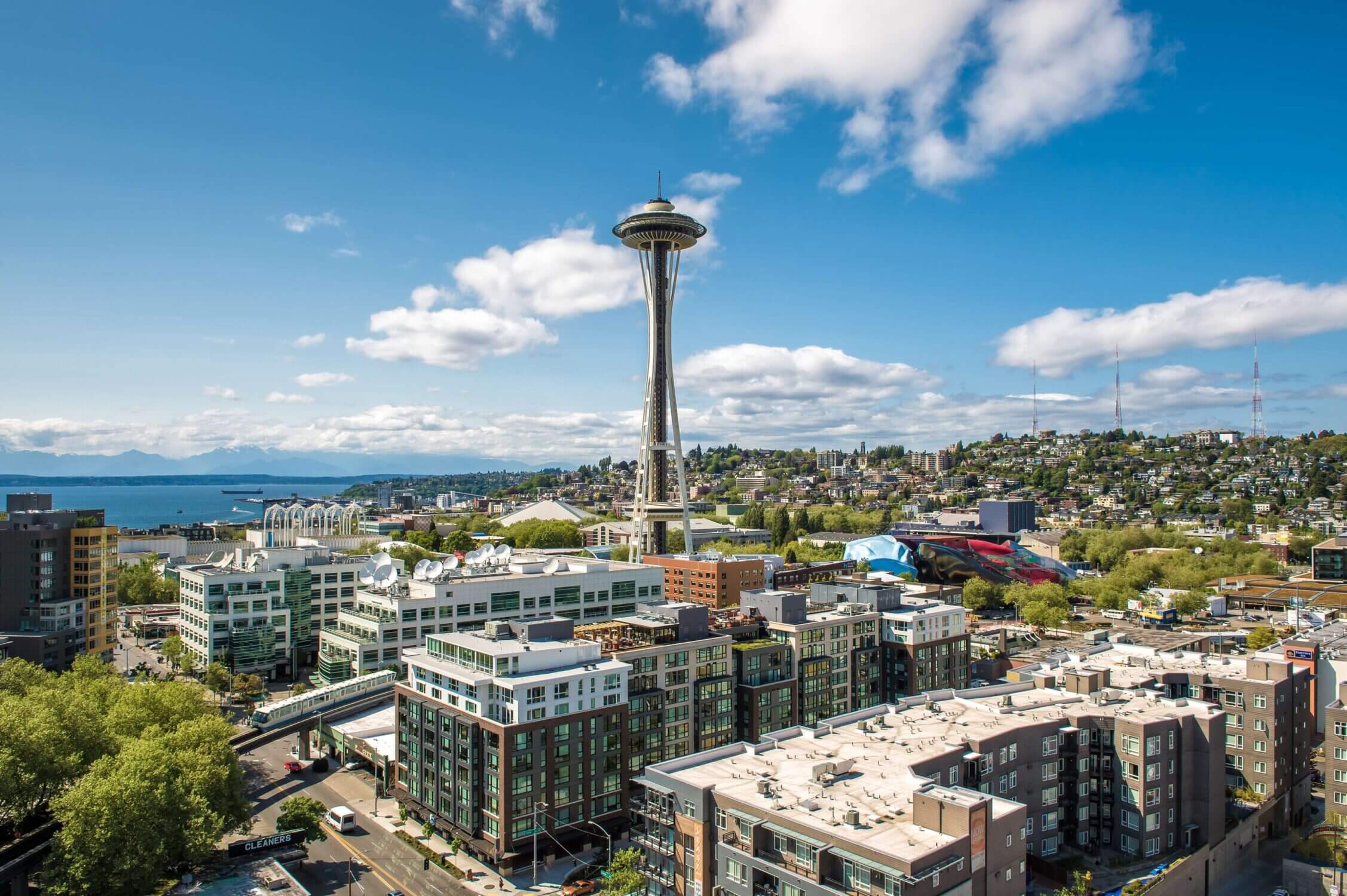 Hyatt House hotel in Seattle’s Queen Anne neighborhood, a top pick for families with kids. The hotel is conveniently located near the Seattle Center, with the iconic Space Needle and monorail visible in the background—everything is within easy walking distance.
