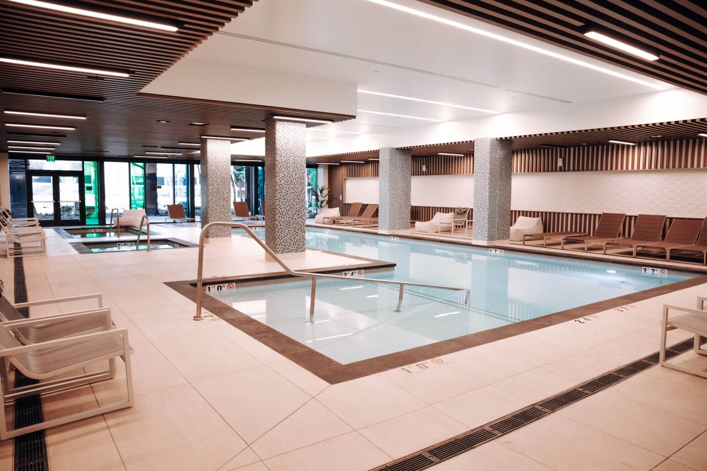 Indoor heated pool at Level Seattle Downtown in South Lake Union, a family-friendly amenity perfect for kids to swim and play year-round in this top Seattle hotel.